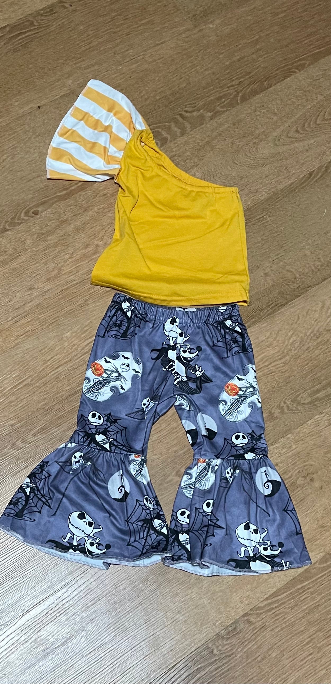 Yellow off the shoulder shirt with Nightmare Before Christmas Pants