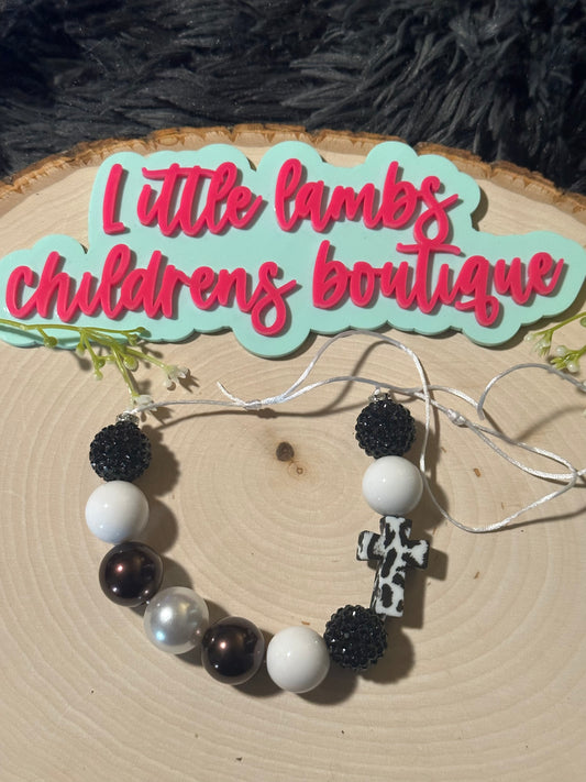 Silicone cross with acrylic beads