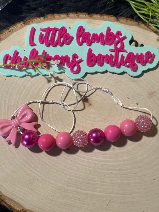 Pink beads with bow
